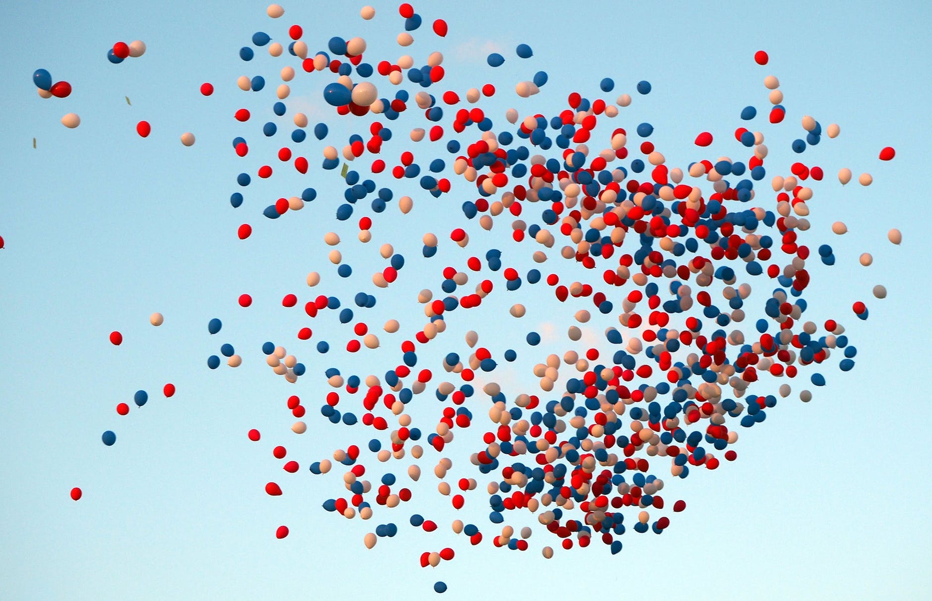 colorful balloons released in the sky